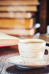 Wall Mural - Coffee morning in the workplace. with a book or laptop. selective focus.