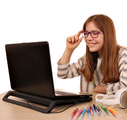 Wall Mural - Happy little girl playing laptop and fun