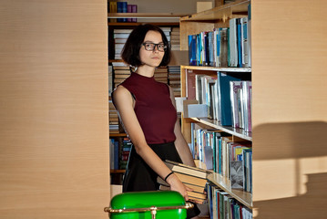 girl with books in the library