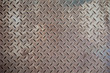 © kanpisut - Steel texture from Manhole cover. Metallic background and wallpaper. Detail of Manhole cover pattern