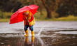 © JenkoAtaman - happy child baby boy with rubber boots and umbrella jump in puddle  on autumn walk