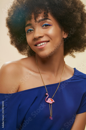 A Close Up Portrait Of A Young African Lady With Short Curly Hair