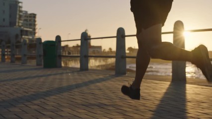 fit young man running fast athlete training endurance runner jogging cardio exercise workout on calm