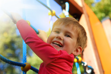 Boy playing on monkey bars