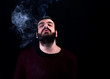 © buraktumler - portrait of smoker man in front of black background