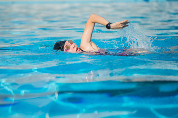 Canvas Print - woman swimming in the swimming pool