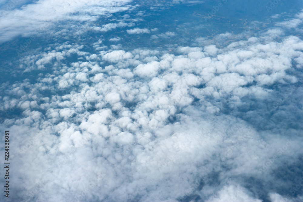 Natural cloudscape view from airplane window. - obrazy, fototapety, plakaty 