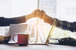 © lesterman - Two business use hand to fist bump for succes teamwork coporate,Office Team Meeting with Hands together. Industry Business Work Concept