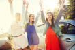 © Syda Productions - summer vacation, holidays, travel, road trip and people concept - happy teenage girls or young women near car at seaside