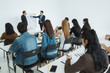 © saksit - Two businessman presentation in a conference meeting room and Audience of the lecturer