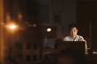 © mavoimages - Young Asian businessman working alone in his office at night