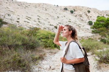 Wall Mural - hiker woman with backpack on trekking trail, travel and active lifestyle concept