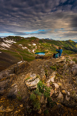 Wall Mural - Tourist admires view from California Pass towards lake Como and Poughkeepsie Gulch