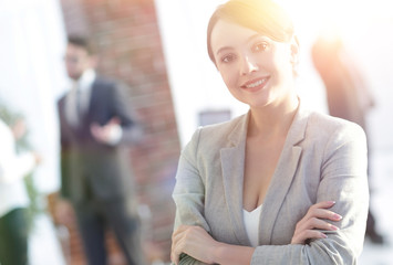 Wall Mural - portrait of confident business woman on the background of the office.