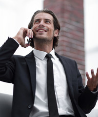 Wall Mural - business man talking on smart phone.