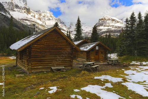 Alpine Club Of Canada Wilderness Log Cabin And Distant Snowy