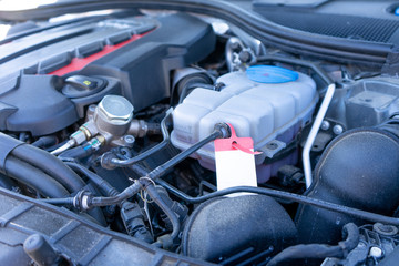 The engine of the modern car, the bonnet is open.