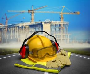 Safety helmet with earphones and goggles on