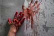 Bloody hand print on wall, crime and horror concept.