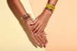 © 5second - Female hands with bracelets and rings on colorful background