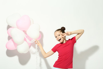 Wall Mural - Beautiful young girl with balloons on white background