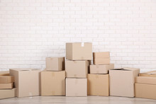 Cardboard Boxes On Brick Wall Background