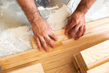 Wall Mural - Assembling of parquet floor in progress