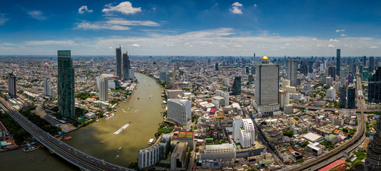 Wall Mural - aerial view of bangkok skyline and skyscraper with bts skytrain bangkok downtown. panorama of sathor