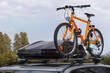 Transportation of bicycles on the roof of the car. Concept: a car trip with a bike