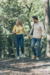 © LIGHTFIELD STUDIOS - young couple holding hands while walking in autumn park together