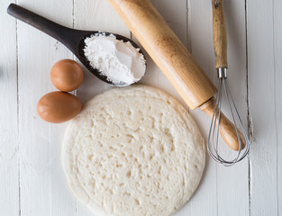 eggs and powder on white wooden background,