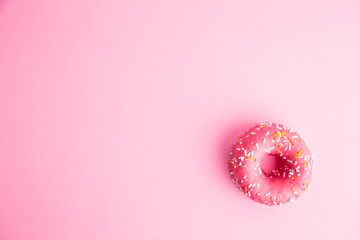 Wall Mural - pink donut in colorful background