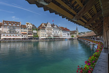 View Of The Old Town With Town Hall From Chapel Bridge, Wooden Footbridge Across The Reuss River In The City Of Lucern, Switzerland.