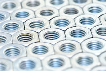 Fasteners On A White Background. Manufacture Of Metal Products.