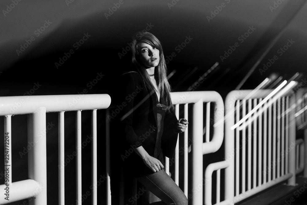 Resting On Railing Girl at night on the street, resting on a railing. Converted to black ...