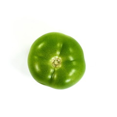 Wall Mural - Green tomato on white background 