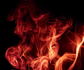 Red smoke on black background