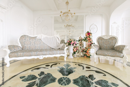 Morning In Luxurious Light Interior In Mansion Bright And Clean Interior Design Of A Luxury Living Room With Stone Floors Fireplace Sofa And Chair Stucco On Walls Buy This