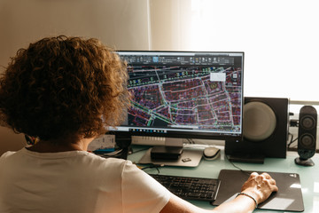 Architect drawing with cad software designing building