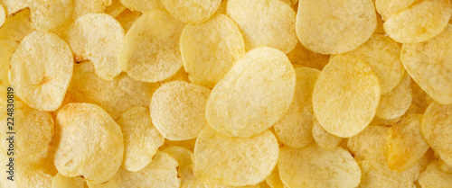 Fotografía crispy potato chips snack texture background top view