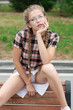 nerd girl in short dress in provocative pose