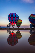 Hot Air Balloons Taking Off Over Lake