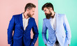 Tense face expression competitors. Business competition and confrontation. Business partners competitors in suits with tense bearded faces. Businessmen stylish appearance jacket pink blue background