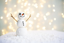 Merry Christmas And Happy New Year Greeting Card With Copy-space.Happy Snowman Standing In Winter Christmas Landscape.Snow Background