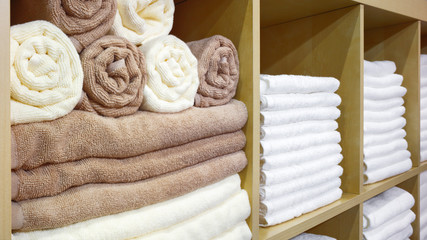 Leinwandbilder - White and brown beige Towels Folded and Stacked on a Shelf