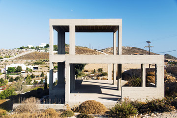 A view of a concrete house construction in the island of Patmos, Greece in summer time