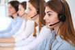 © rogerphoto - Call center. Beautiful cheerful smiling operator consulting clients with headset. Business concept of customer service