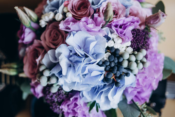 wedding bouquet of red and blue flowers