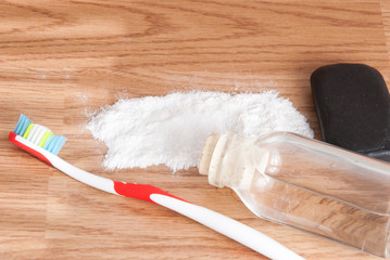 baking soda and lemon on wooden table