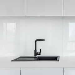 Kitchen with black sink